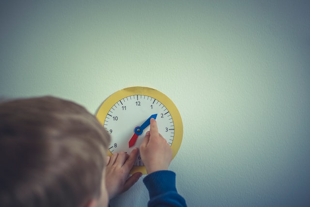boy learning how to tell the time
