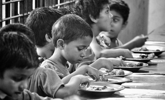 children eating in an orphanage